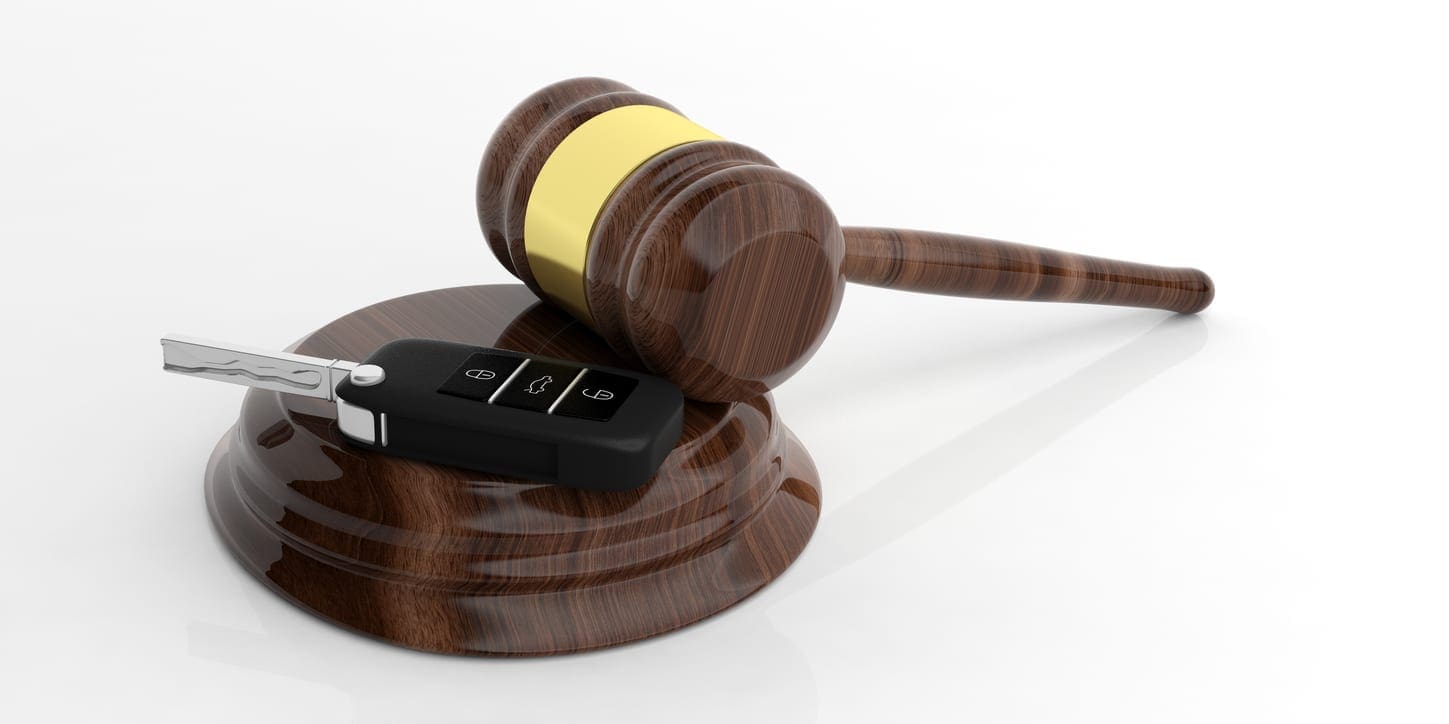 Car key and judge gavel on white 3d illustration Driving Matters
